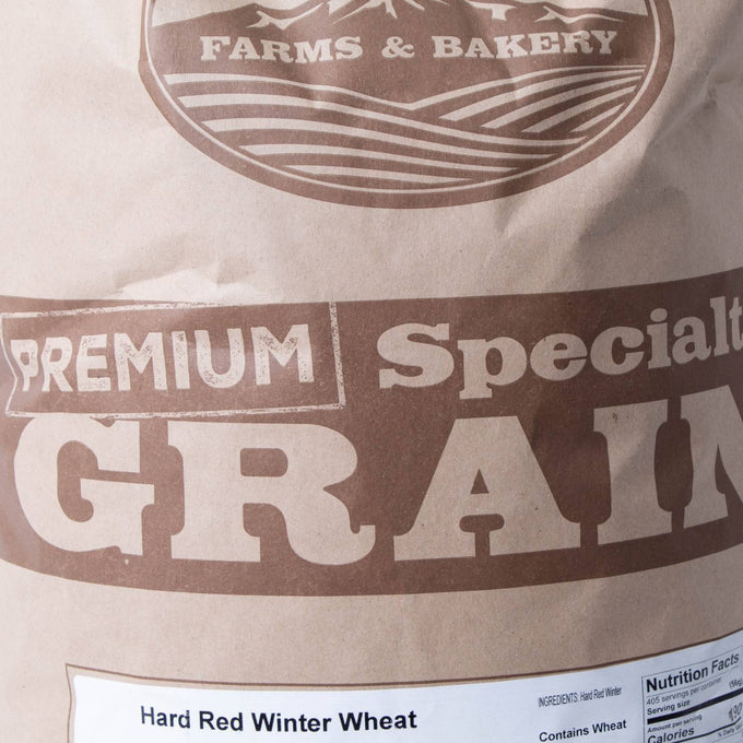 Close-up of a handcrafted brown paper bag labeled for premium hard red winter wheat grain, highlighting its suitability for baking and milling, featured in Farm, Garden & Tool, Pantry, and USA Made collections.