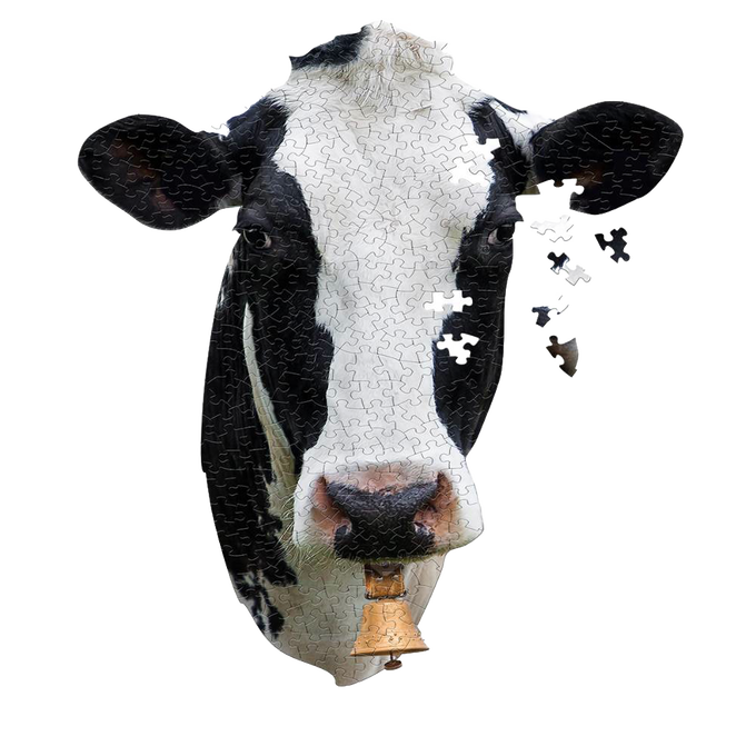 Partially assembled cow head-shaped jigsaw puzzle featuring a close-up black and white cow face with a bell, designed for children’s toys and games collections.