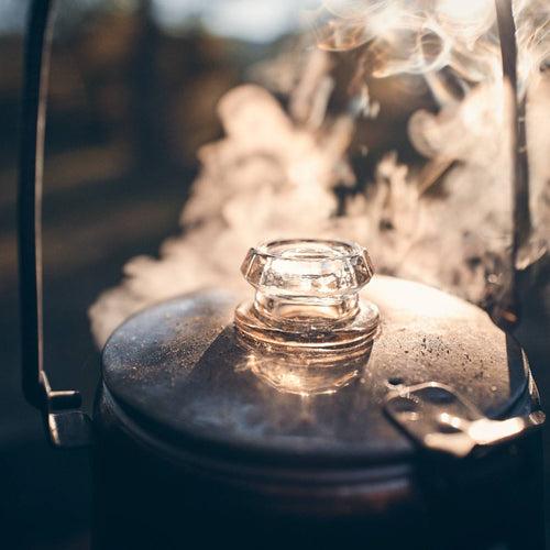 Clear glass knob replacement atop a steaming metal percolator lid, highlighting craftsmanship for Kitchen & Food and Brewing Coffee and Tea collections.
