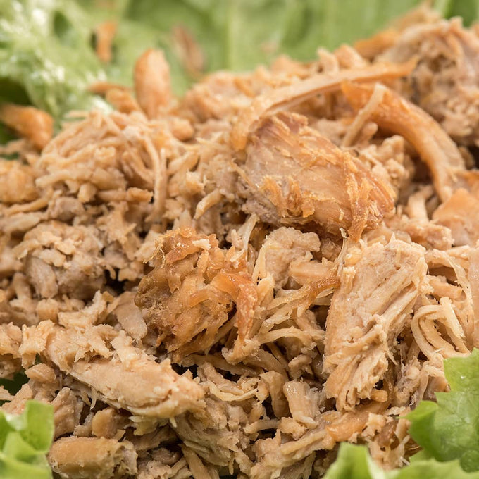 Close-up of Amish-crafted tender shredded pork with a natural texture served on fresh green lettuce, perfect for Farm, Garden & Tool, Kitchen & Food, Emergency Supplies, Food, Meats, Best Sellers, and Promo Eligible collections.