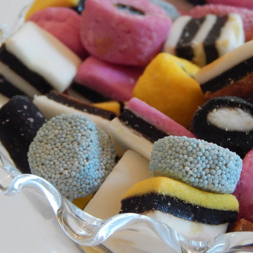 Close-up of an assortment of colorful old-fashioned licorice mix candies in various shapes and fruit flavors, handcrafted and made in USA, featured in Kitchen & Food, Candy, and Snacks collections.
