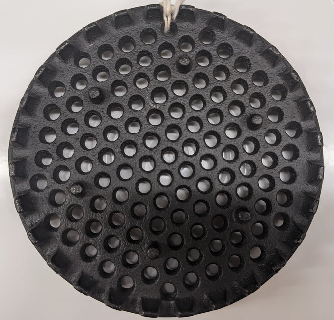 Black metal strainer disk with evenly spaced round holes and notched edges, designed as a durable specialty kitchen and food butchering supply, USA made and popular in best sellers.
