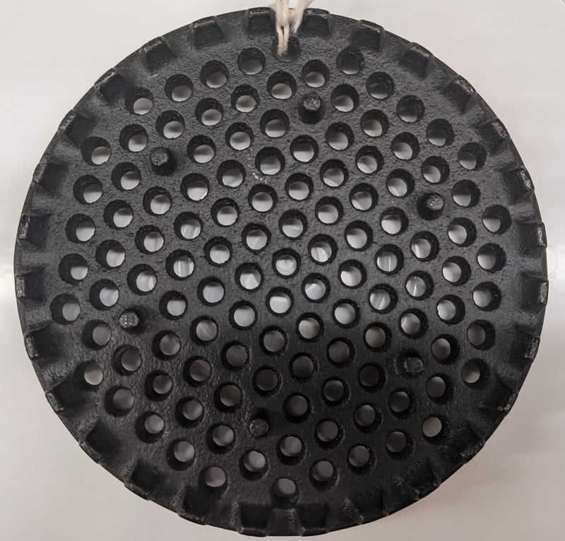 Black metal strainer disk with evenly spaced round holes and notched edges, designed as a durable specialty kitchen and food butchering supply, USA made and popular in best sellers.