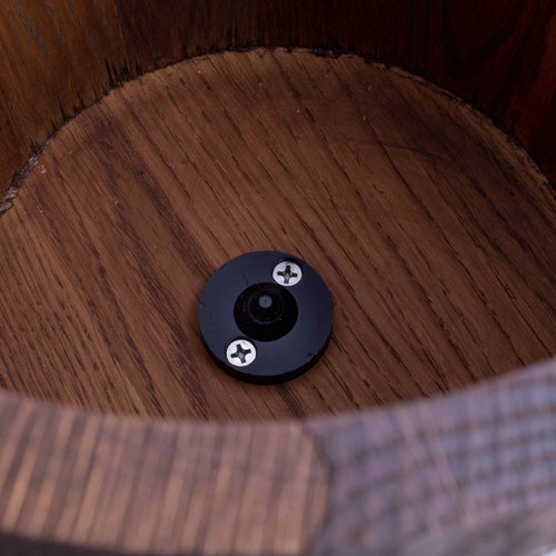 Close-up of the interior bottom of a handcrafted wooden ice cream freezer bucket featuring a central black metal fitting with two screws, part of a Lehman's Best Ice Cream Freezers model in Kitchen & Food and Specialty Equipment collections.