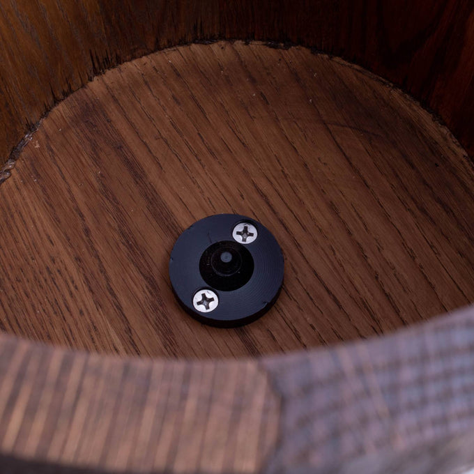Close-up of the interior bottom of a handcrafted wooden ice cream freezer bucket featuring a central black metal fitting with two screws, part of a Lehman's Best Ice Cream Freezers model in Kitchen & Food and Specialty Equipment collections.