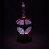 Unique handcrafted vintage-inspired holiday bubble light featuring swirling glitter inside a red and green glass body, ideal for Home & Decor, Holiday Decor, Best Sellers, Promo Eligible collections.