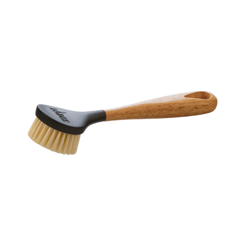 Scrubbing brush with stiff nylon bristles and an ergonomic natural wood handle, designed for cleaning cast iron cookware, featured in Kitchen & Food, Cookware, Cast Iron, Best Sellers, and Promo Eligible collections.