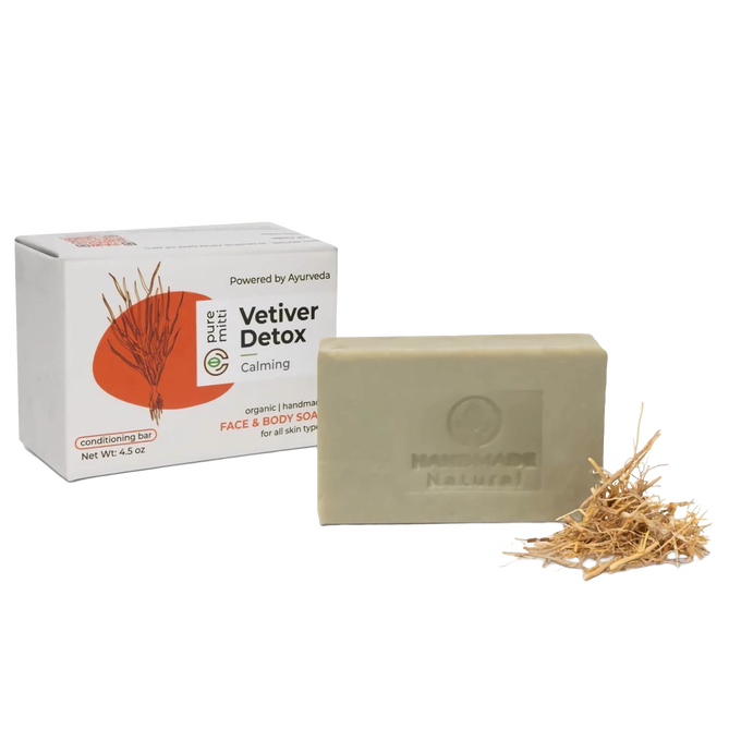 Handcrafted vetiver bar soap with soothing detox properties, enriched with organic coconut oil, shown with natural vetiver roots and packaging, featured in Health & Wellness and Soaps collections.