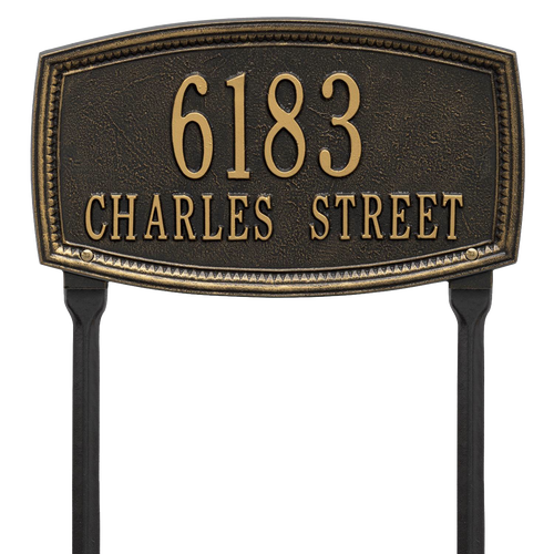 Black custom lawn address plaque with raised gold numbers and lettering featuring a traditional shaped border, designed to enhance curb appeal and made in USA.