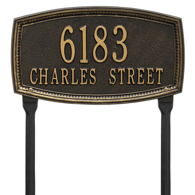Black custom lawn address plaque with raised gold numbers and lettering featuring a traditional shaped border, designed to enhance curb appeal and made in USA.