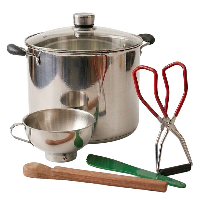 Handcrafted stainless steel water bath canner with glass lid, accompanied by a stainless steel funnel, wooden stirring paddle, red-handled jar lifter, and green tongs for Kitchen & Food, Food Preservation, and Canning collections.