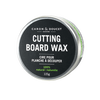 Round tin of 100% natural cutting board wax conditioner with green accents, designed for wood care in Kitchen & Food and Food Prep collections.
