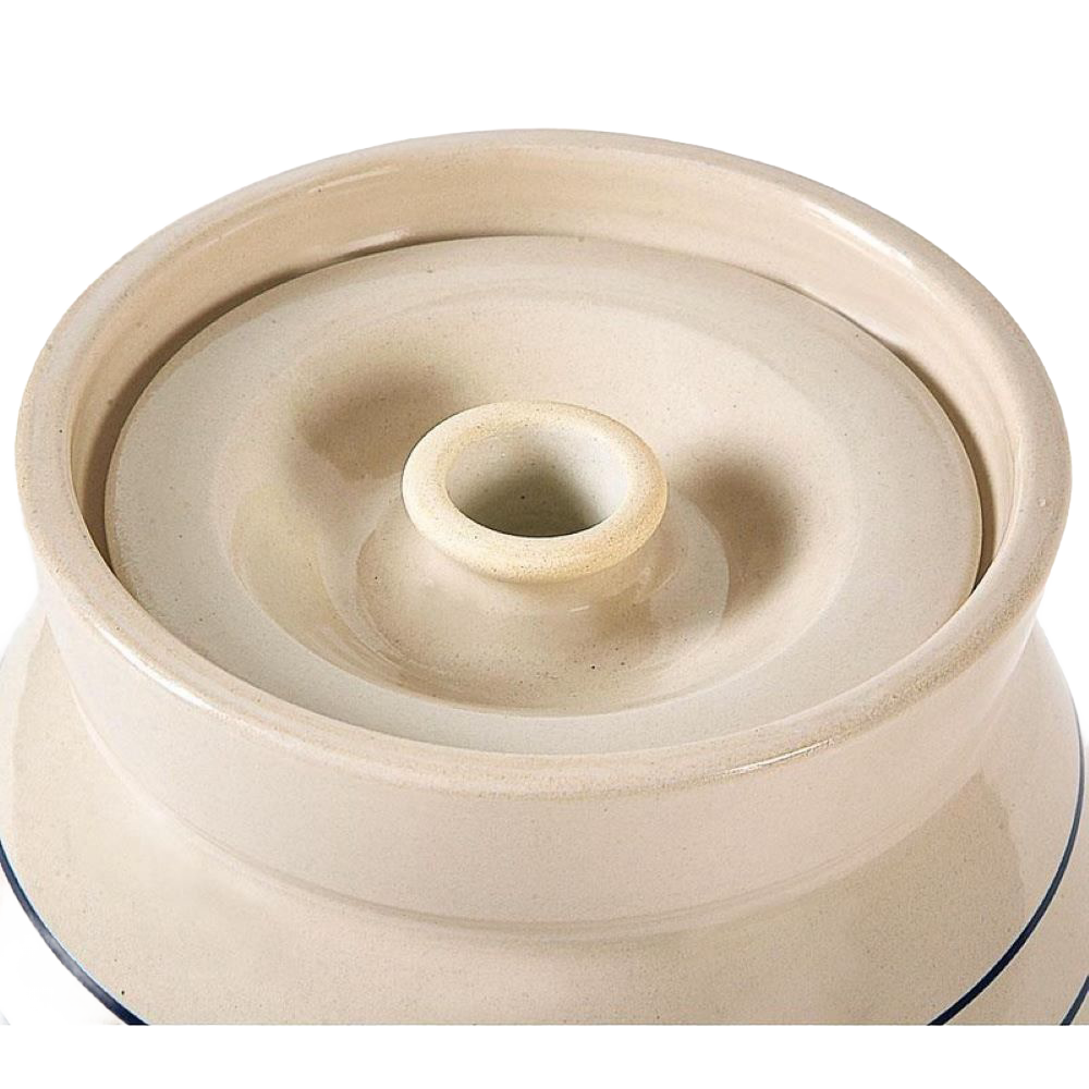 Close-up of the handmade stoneware lid in cream with a subtle blue stripe accent, part of the USA Made Kitchen & Food and Storage and Serving collections.