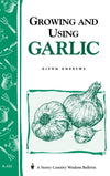 Cover of a how-to book featuring hand-drawn illustrations of garlic bulbs and garden tools, part of Toys, Books & Games and Home and Garden collections.