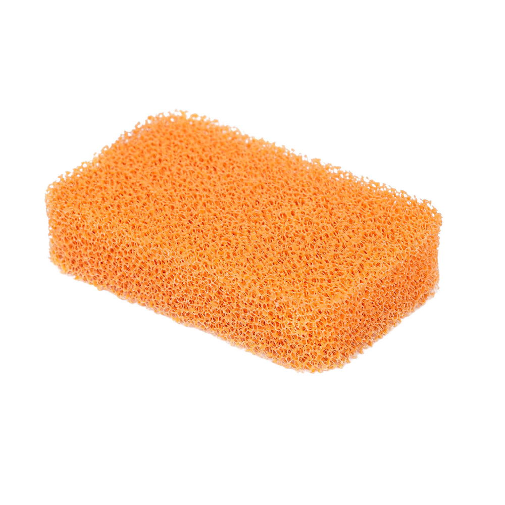 Orange silicone dish scrubber with porous texture, resistant to mold and mildew, designed for gentle cleaning in household cleaning and kitchen gadget collections.