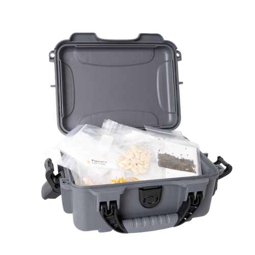 Durable waterproof storage case opened to show organized clear bags containing various heirloom seeds, designed for farm and garden use, handcrafted for durability and reliability.