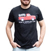 Adult wearing a charcoal soft cotton t-shirt featuring a bright red vintage truck graphic with Lehman's logo and "For a Simpler Life" text, ideal for Clothing and Accessories and Best Sellers collections.