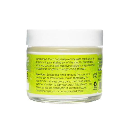 Clear jar of peppermint brushing soap tooth suds with bright green label detailing nonabrasive, enamel-strengthening formula, part of USA made health and wellness grooming collection.