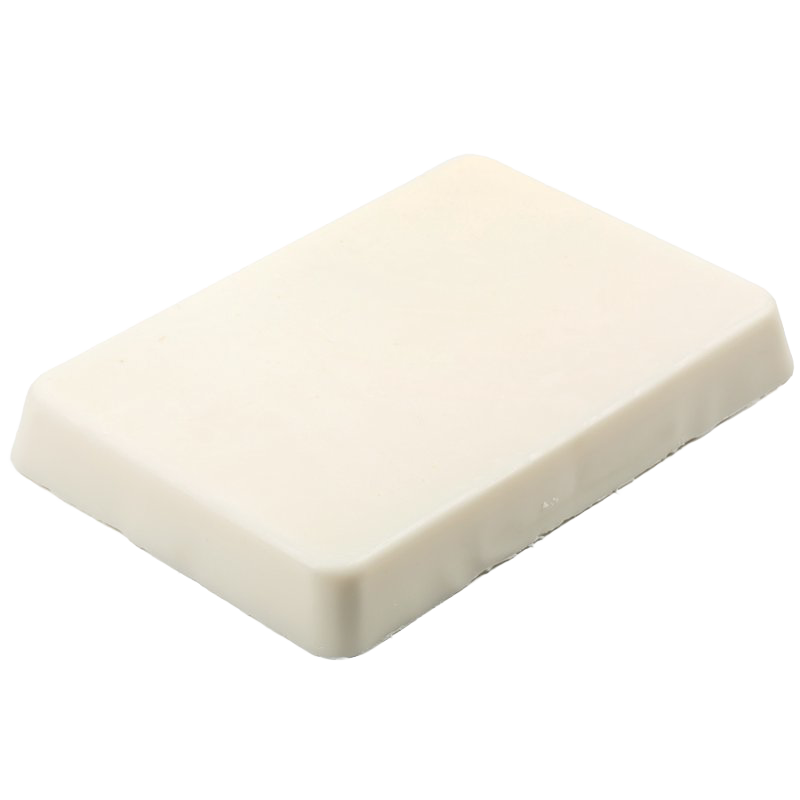 Rectangular block of smooth, off-white soy wax for candlemaking, handcrafted to minimize shrinking and smoke, ideal for use in glass or tin containers in candlemaking supplies.