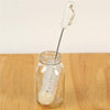 White foam tip cleaning brush with twisted metal handle and hanging loop, shown inside a clear glass jar on a wooden surface, ideal for Home & Decor, Household Cleaning, and USA Made collections.