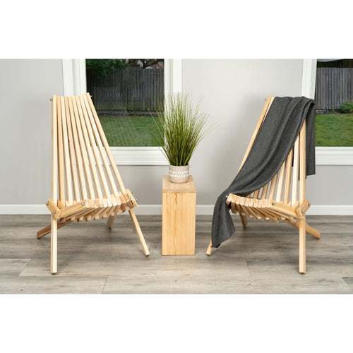 Handcrafted cypress wood folding chairs with a sturdy slatted design, shown with a gray throw and decorative plant, featured in Home & Decor, Outdoor Furniture, and Amish Made collections.