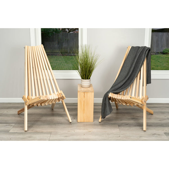 Handcrafted cypress wood folding chairs with a sturdy slatted design, shown with a gray throw and decorative plant, featured in Home & Decor, Outdoor Furniture, and Amish Made collections.