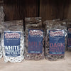 Three clear resealable bags of handcrafted Amish made chocolate covered pretzels in white, milk, and dark chocolate varieties, displayed on a wooden shelf, perfect for Kitchen & Food, Snacks and Sweets, Candy, USA Made, Best Sellers, and Promo Eligible collections.