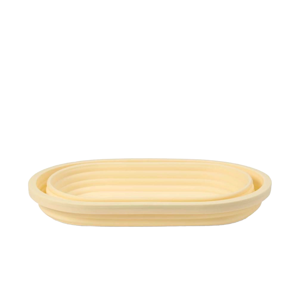 Oval collapsible bread proofing basket made of durable silicone with steel rim, designed for shaping and rising dough while saving storage space, ideal for Kitchen & Food and Baking Supplies collections.