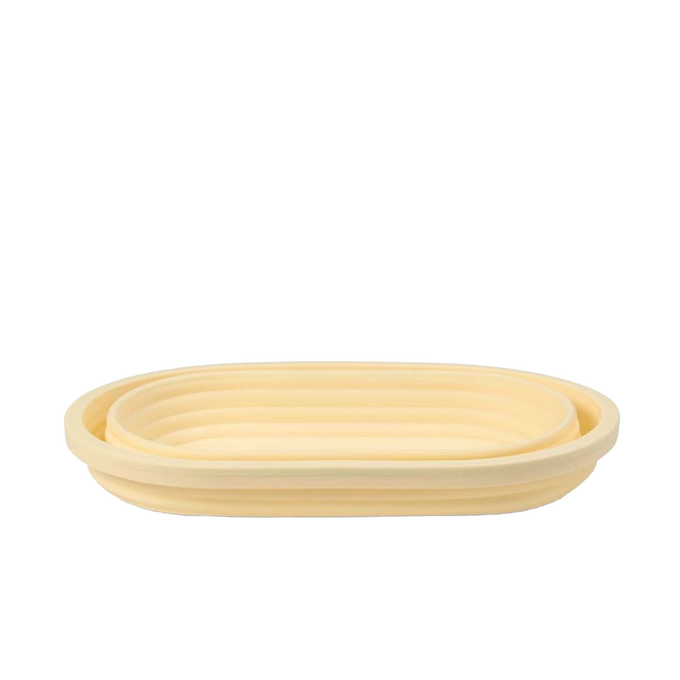 Oval collapsible bread proofing basket made of durable silicone with steel rim, designed for shaping and rising dough while saving storage space, ideal for Kitchen & Food and Baking Supplies collections.