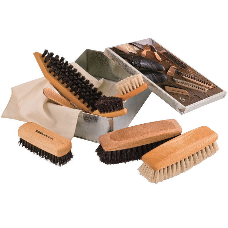 Wooden shoe care set featuring multiple brushes with natural bristles arranged beside a metal storage box and instruction booklet for cleaning and polishing footwear, ideal for cleaning utensils and best sellers collections.