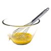 Professional-quality stainless steel whisk resting in a clear glass bowl with whisked egg mixture, ideal for Kitchen & Food, Baking Supplies, Cookware, and Kitchen Gadgets collections.