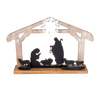 Handcrafted wooden nativity display with weathered finish, featuring metal silhouettes of the Holy Family and animals under a star, perfect for Home & Decor and Holiday Decor collections.