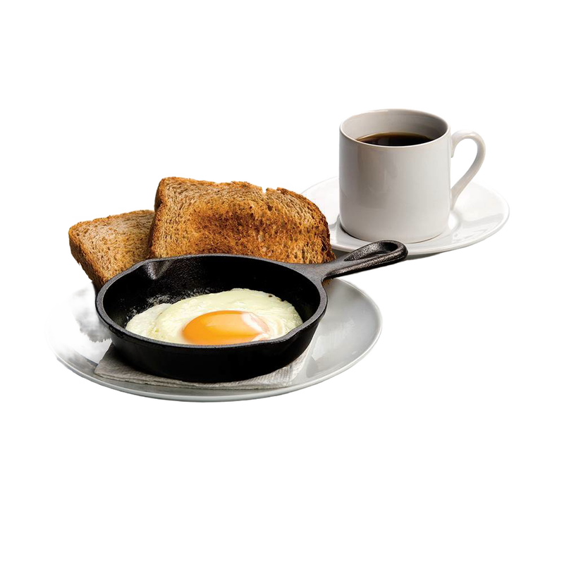 Small cast iron skillet with a cooked sunny-side-up egg, served on a white plate alongside two slices of toasted bread and a cup of black coffee, ideal for kitchen and cookware collections.