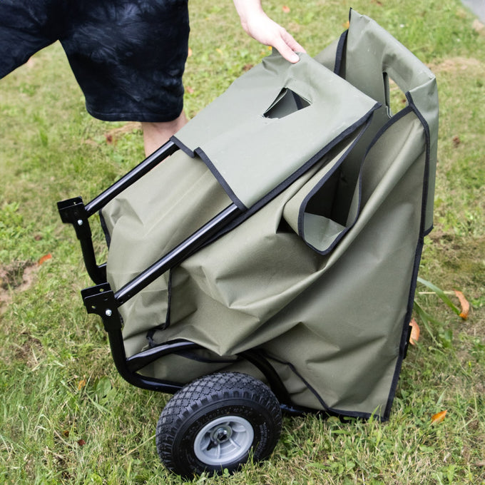 Foldable garden and firewood cart with sturdy black steel frame and durable olive-green fabric liner, featuring large wheels for easy hauling in farm, lawncare, and wood cutting collections.