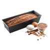Rectangular heavy gauge steel loaf pan with nonstick textured surface showing baked bread inside, accompanied by eggs, cinnamon sticks, nuts, and a small bowl of brown flour for Kitchen & Food and Baking Supplies collections.