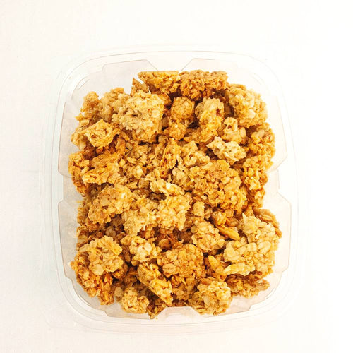 Plastic container filled with crunchy peanut butter granola clusters, showcasing a golden brown texture, featured in Kitchen & Food, Pantry, Dry Goods and Mixes, and USA Made collections.