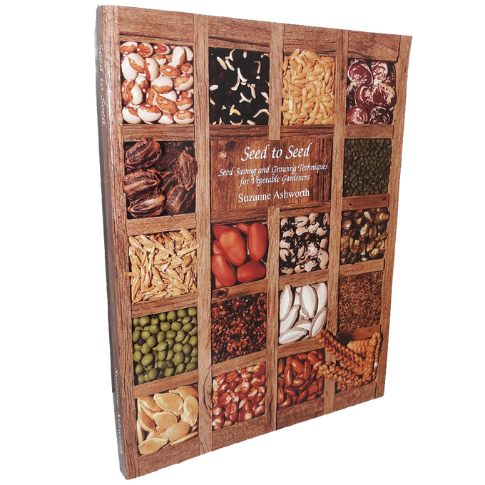 Book cover featuring an array of assorted vegetable seeds displayed in a wooden grid, highlighting seed saving and growing techniques, featured in Toys, Books & Games, Books, Home and Garden How-To Books, Best Sellers, and Promo Eligible collections.