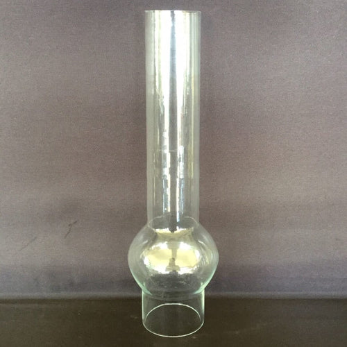 Tall clear glass chimney with a distinctive rounded bulge and narrow base, designed for oil lamps, featured in Lamps & Lighting and Parts and Accessories collections.
