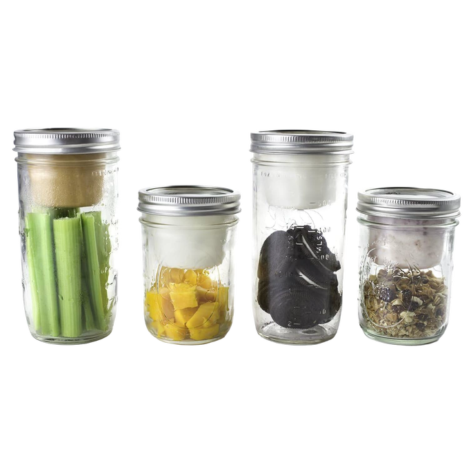 Four clear wide-mouth jars fitted with metal lids and white plastic divider cups, each holding different snacks like celery, diced mango, dark chocolate pieces, and granola, showcasing reusable kitchen gadgets for organized food storage and portioning, ideal for Kitchen & Food, Kitchen Accessories, Storage and Serving, USA Made, Best Sellers, and Promo Eligible collections.