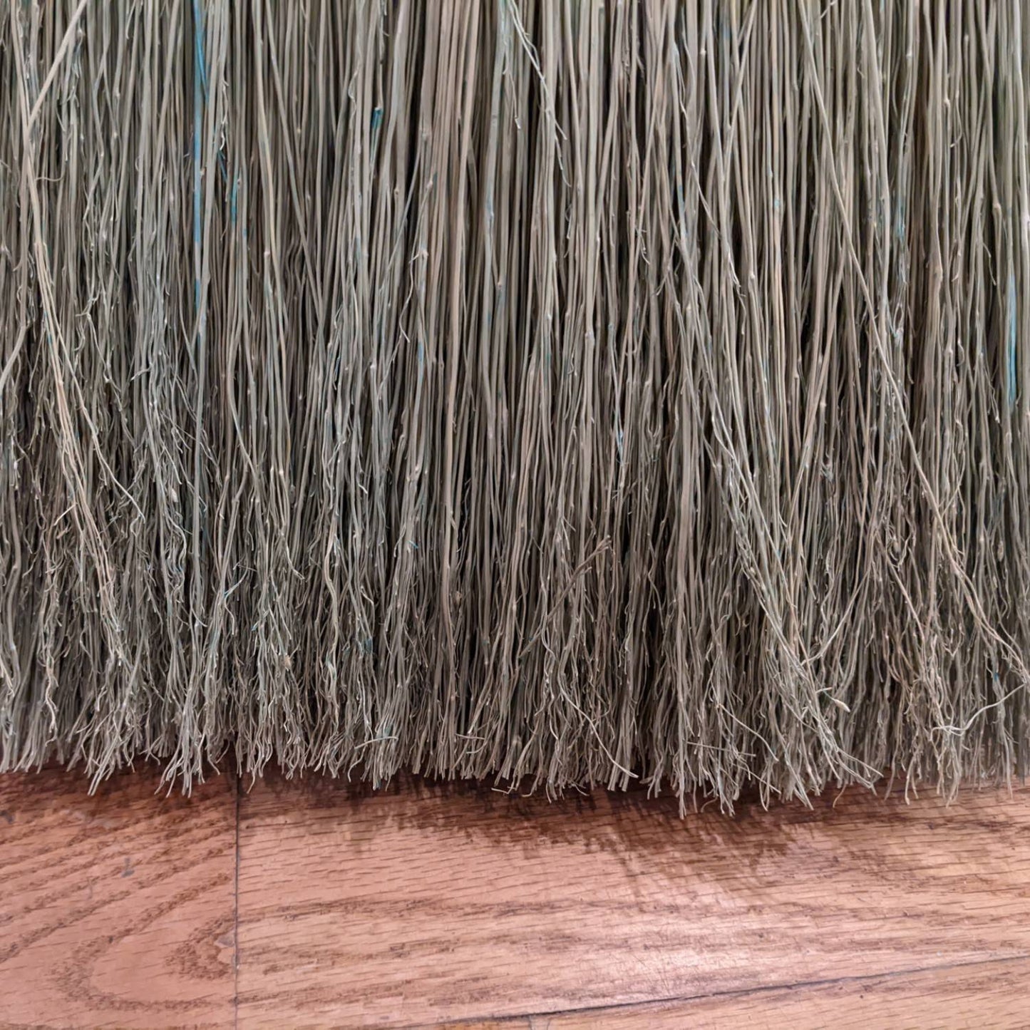Close-up of handcrafted corn straw bristles with natural texture, part of an Amish made broom, ideal for home cleaning and featured in Household Cleaning and USA Made collections.