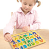 Young child playing with a colorful wooden Alphabet Sound Puzzle featuring raised letters that pronounce each letter when placed, part of Toys, Children's Toys, and Puzzles collections.