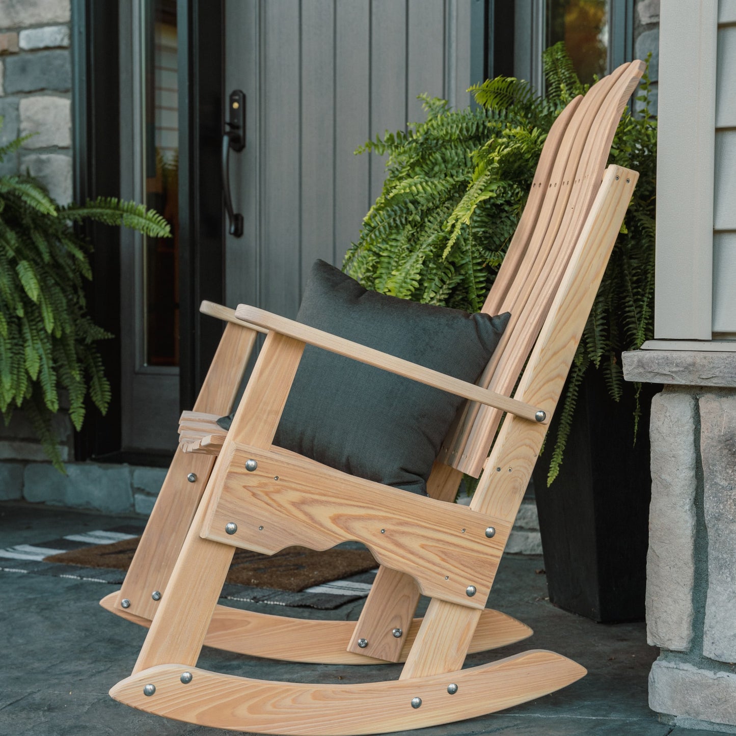 Handcrafted cypress rocking chair made by Amish craftsmen, designed for outdoor and indoor use with durable, naturally insect-repellent wood, featured in Home & Decor and USA Made collections.