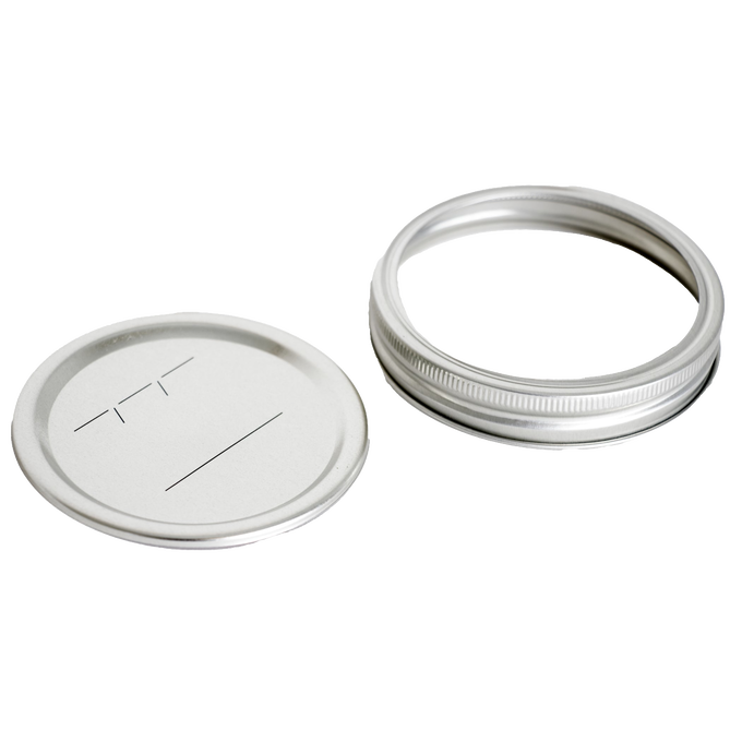 Wide-mouth metal canning jar lid and silver screw band featuring BPA-free sealing compound, ideal for food preservation in Kitchen & Food and Canning collections.