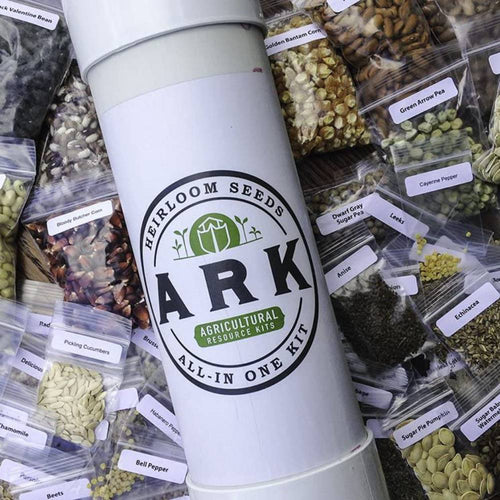 Tall white cylindrical container labeled handcrafted ARK heirloom seeds kit with assorted clear packets of organic vegetable and herb seeds, featured in farm, garden & tool, seeds and planting, and USA made collections.