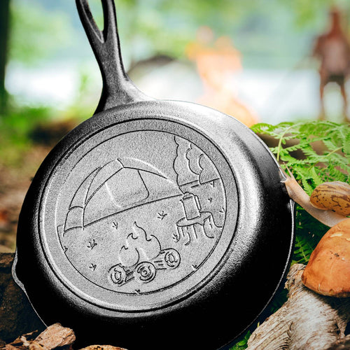 Handcrafted 8-inch cast iron skillet made in USA, featuring a charming embossed campsite design, ideal for camping, cookware, and kitchen enthusiasts seeking durable outdoor tools.