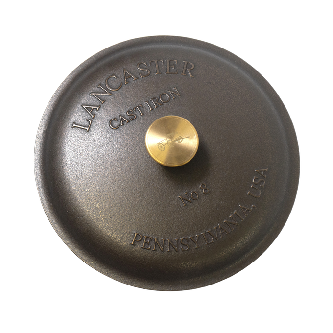 Handcrafted cast iron skillet lid with smooth finish and solid brass knob, embossed with Lancaster Pennsylvania USA and No 8, perfect for Kitchen & Food, Cast Iron, USA Made, and Best Sellers collections.