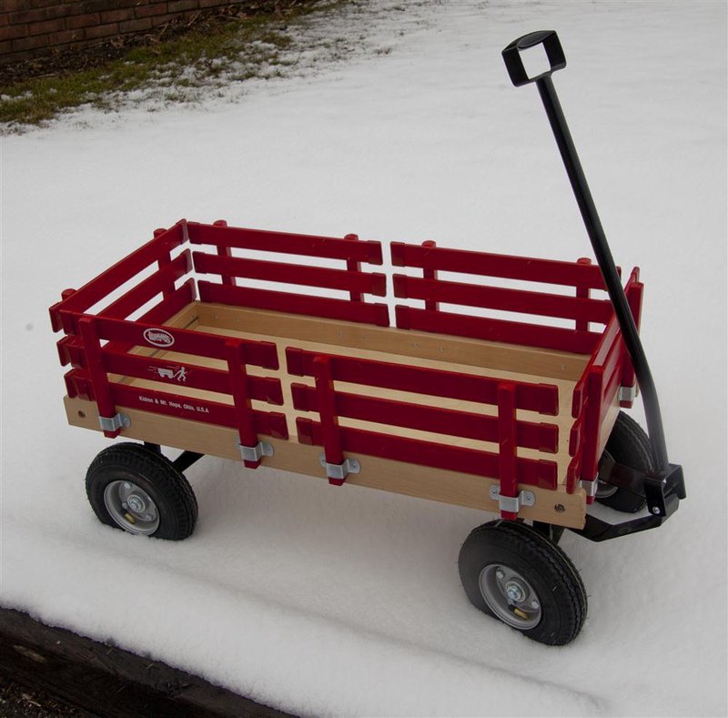 Handcrafted Amish made children's wagon with red wooden slats, sturdy metal frame, black pull handle, and durable rubber tires, part of USA Made and Outdoor Play collections.
