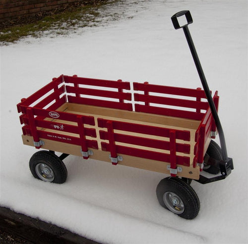 Handcrafted Amish made children's wagon with red wooden slats, sturdy metal frame, black pull handle, and durable rubber tires, part of USA Made and Outdoor Play collections.