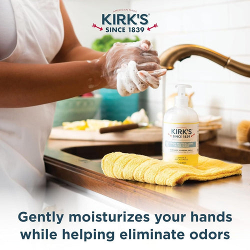 Person washing hands with foaming lather in kitchen sink next to pump bottle of Kirk's Odor Neutralizing Hydrating Hand Wash, featuring coconut oil and aloe vera, USA Made, Health & Wellness and Grooming collections.