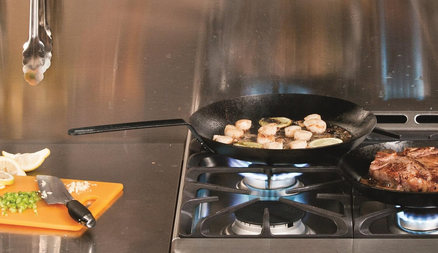 Steel skillet with long handle searing sliced mushrooms and garlic on a gas stove burner, featured in Kitchen & Food, Cookware, Pots and Pans, USA Made, Best Sellers, and Promo Eligible collections.